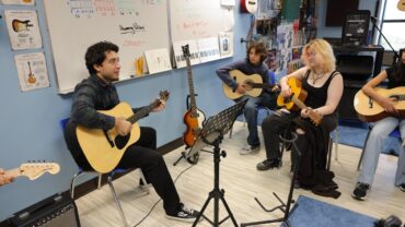 SCVi photo shoot Fall 2023 learners facilitator guitars